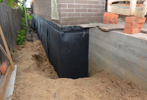 SJ Waterproofing Pros technician performing targeted Waterproofing assessment in Three Oaks, MI